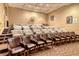 Home theater room with tiered seating and projector screen at 800 N Tamiami Trl # 1506, Sarasota, FL 34236