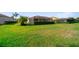 Expansive backyard with well-maintained lawn and tasteful landscaping, perfect for outdoor activities and entertainment at 8007 River Preserve Dr, Bradenton, FL 34212