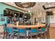 Upscale bar with a marble countertop, comfortable seating, and a variety of beverages at 8007 River Preserve Dr, Bradenton, FL 34212