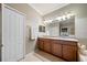 Bathroom with a double vanity, a large mirror and a separate shower at 8007 River Preserve Dr, Bradenton, FL 34212