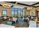Elegant dining room with set tables, large windows, and scenic views at 8007 River Preserve Dr, Bradenton, FL 34212