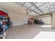 Spacious garage with ample storage and high ceilings, ready for your personal touches at 8007 River Preserve Dr, Bradenton, FL 34212