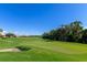 Beautiful golf course view with lush green grass, sand trap, and blue sky at 8007 River Preserve Dr, Bradenton, FL 34212