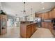 Open kitchen with granite countertops, stainless steel appliances, and views into the living area at 8007 River Preserve Dr, Bradenton, FL 34212