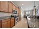 Well-appointed kitchen with granite countertops, stainless steel appliances, and ample cabinet space at 8007 River Preserve Dr, Bradenton, FL 34212