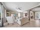 Comfortable living room with an entertainment center, ceiling fan and lots of natural light at 8007 River Preserve Dr, Bradenton, FL 34212
