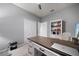Home office featuring a modern desk, shelving, and ample storage space at 8007 River Preserve Dr, Bradenton, FL 34212