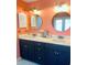 Bathroom with large dual vanity and framed mirror at 810 Hammockwood Ct, Sarasota, FL 34232