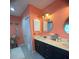 Bathroom with large dual vanity and framed mirror at 810 Hammockwood Ct, Sarasota, FL 34232