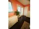 Bedroom with white dresser, large window and access to the backyard at 810 Hammockwood Ct, Sarasota, FL 34232