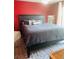Bedroom features a dark wooden frame and bedspread at 810 Hammockwood Ct, Sarasota, FL 34232