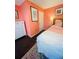 Bright bedroom features dark hardwood floors and white dresser at 810 Hammockwood Ct, Sarasota, FL 34232