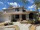 Charming two-story home featuring a well-maintained front yard and a welcoming entrance at 810 Hammockwood Ct, Sarasota, FL 34232