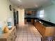 Spacious kitchen with stainless steel appliances, wood cabinets, and bright lighting at 810 Hammockwood Ct, Sarasota, FL 34232
