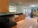 Kitchen featuring dark countertops, stainless steel appliances, and eat in dining area at 810 Hammockwood Ct, Sarasota, FL 34232