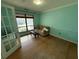 Living room featuring hardwood floors, a comfortable couch, and ample natural light at 810 Hammockwood Ct, Sarasota, FL 34232