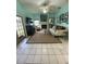 Bright living room features fireplace, ample seating, and french doors at 810 Hammockwood Ct, Sarasota, FL 34232