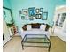 Comfortable living room area with a large sofa and decorative wall art at 810 Hammockwood Ct, Sarasota, FL 34232