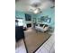 Bright living room features fireplace, ample seating, and a ceiling fan at 810 Hammockwood Ct, Sarasota, FL 34232