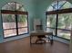 Bright home office featuring large windows and a functional workspace at 810 Hammockwood Ct, Sarasota, FL 34232