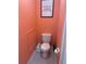 Small lavatory with low profile toilet at 810 Hammockwood Ct, Sarasota, FL 34232