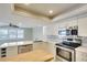 Spacious kitchen with white countertops, stainless steel appliances and center island at 8111 Timber Lake Ln, Sarasota, FL 34243