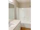 Clean bathroom with a vanity sink and a bathtub with white tile surround at 8314 Drolet Ave, North Port, FL 34291