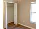 Bedroom with closet, wood-look flooring, neutral paint, and a window at 8314 Drolet Ave, North Port, FL 34291