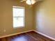 Bedroom featuring modern vinyl flooring, a window, and neutral paint at 8314 Drolet Ave, North Port, FL 34291