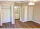 Bright main bedroom with hardwood floors, closet and ensuite bathroom at 8314 Drolet Ave, North Port, FL 34291