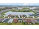 Aerial view of a vibrant neighborhood with multiple ponds, and well-maintained homes and lawns at 8330 Abalone Loop, Parrish, FL 34219
