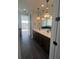 Bathroom boasts double sinks, modern lighting, and sleek tile flooring at 8330 Abalone Loop, Parrish, FL 34219
