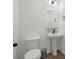 A half bathroom with a pedestal sink and nautical decor at 8330 Abalone Loop, Parrish, FL 34219