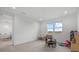 Bright playroom with plush carpeting, large window overlooking exterior landscape, and -size furniture at 8330 Abalone Loop, Parrish, FL 34219
