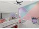 A bedroom with a bunk bed and bright geometric wall art at 8330 Abalone Loop, Parrish, FL 34219