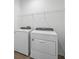 Convenient laundry room with washer and dryer, plus wire shelf at 8330 Abalone Loop, Parrish, FL 34219
