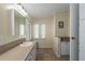 Bathroom with neutral countertop, mirror, and tile flooring at 8409 Imperial Cir, Palmetto, FL 34221