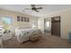 Bedroom with carpet, ceiling fan, and sliding mirror closet doors at 8409 Imperial Cir, Palmetto, FL 34221