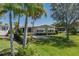Inviting single-story home with a lovely front yard, mature trees, and a screened-in lanai perfect for relaxation at 8409 Imperial Cir, Palmetto, FL 34221