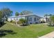 Charming home with well-maintained lawn, landscaping, and a carport at 8409 Imperial Cir, Palmetto, FL 34221