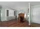 Open-plan room with custom shelving, laminate floors, and a desk at 8409 Imperial Cir, Palmetto, FL 34221