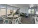 Sunroom with tile flooring, large windows, and a dining table with seating at 8409 Imperial Cir, Palmetto, FL 34221