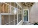Inviting entrance with a 'Welcome' mat, windows, and a door with the number 307 at 850 S Tamiami Trl # 307, Sarasota, FL 34236