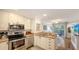 Updated kitchen and open floor plan connects to the living area and outdoor lanai at 850 S Tamiami Trl # 307, Sarasota, FL 34236