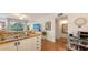 Bright kitchen with stainless steel sink, wooden countertops, and open floorplan at 850 S Tamiami Trl # 307, Sarasota, FL 34236