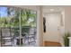 Patio area with seating and a view of lush greenery, accessible from the living area at 850 S Tamiami Trl # 307, Sarasota, FL 34236
