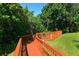 Scenic wooden walkway surrounded by lush landscaping and greenery at 850 S Tamiami Trl # 307, Sarasota, FL 34236
