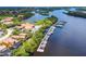 Stunning aerial view of a waterfront community featuring a marina, clubhouse, and resort-style pool at 9441 Discovery Ter # 101A, Bradenton, FL 34212