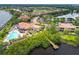 Breathtaking aerial view showcasing the community's waterfront location, clubhouse, and pool at 9441 Discovery Ter # 101A, Bradenton, FL 34212