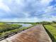 Scenic boardwalk winding through lush greenery and tranquil waters, offering a peaceful escape into nature at 9441 Discovery Ter # 101A, Bradenton, FL 34212